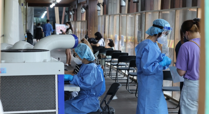 S. Korea's new COVID-19 cases back above 20,000 in 1 1/2 months