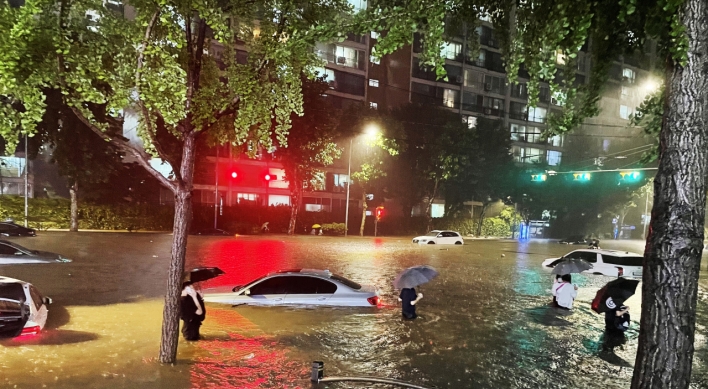 Yoon bashed for working from home as downpour traps him overnight