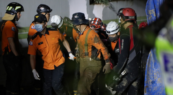 2 rescued, 7 dead from submerged parking garage in Pohang