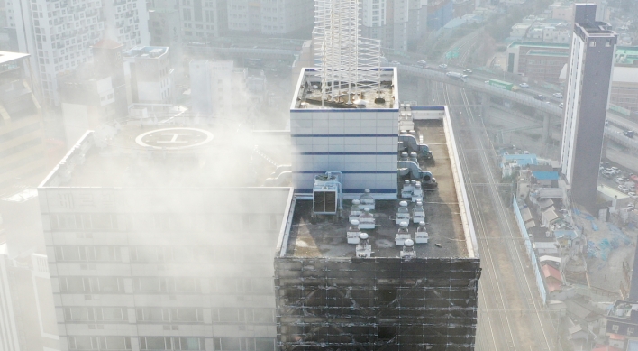 Fire engulfs parking tower in Busan; no injuries reported