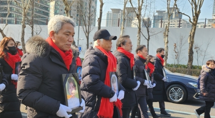 Families of crowd crush victims hold memorial rally in downtown Seoul