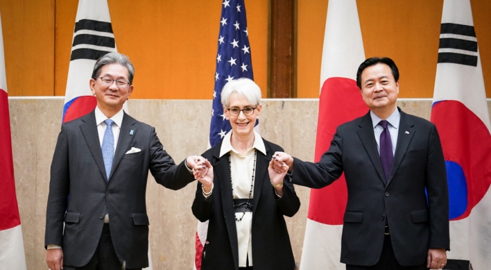 Three-way talks back checks on N. Korea, China