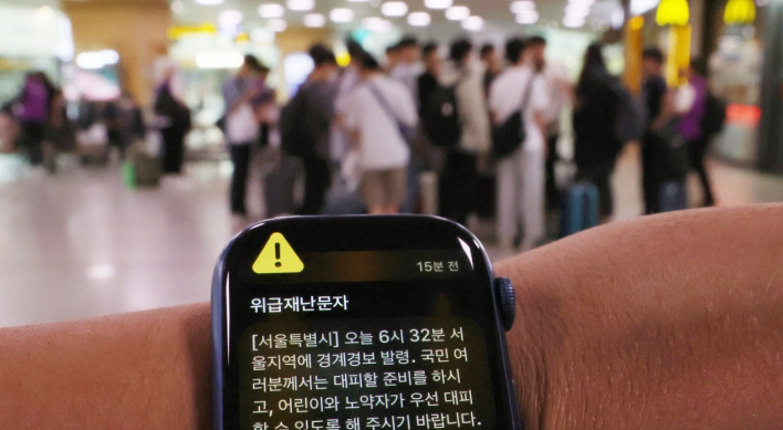 Sirens, alerts unsettle foreign residents in chaotic Seoul morning