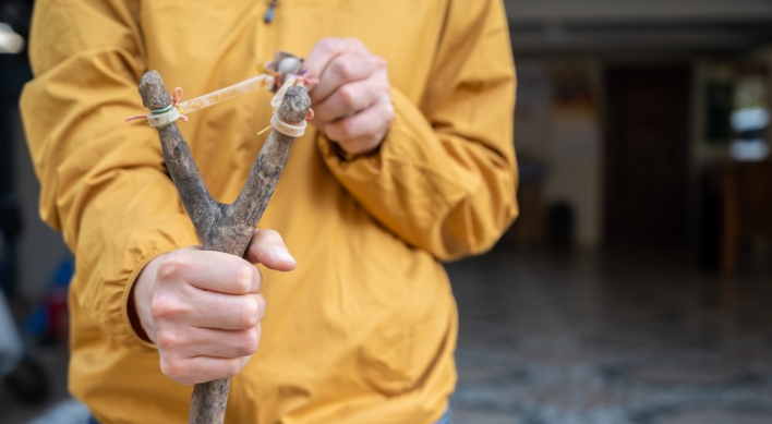 Vietnamese students nabbed for catapulting steel balls at apartment windows