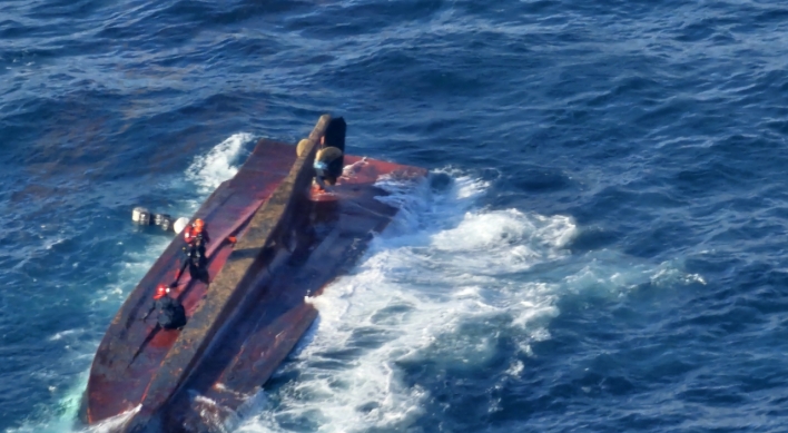 Fishing boat capsizes, leaving 4 dead, 5 missing