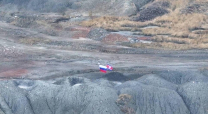 Russian, NK flags displayed together on Ukraine battlefield