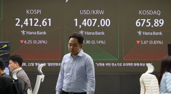 Seoul shares open lower as Fed hints at slowing rate cut