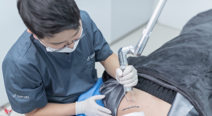 Doctor eases pain of tattoo regrets