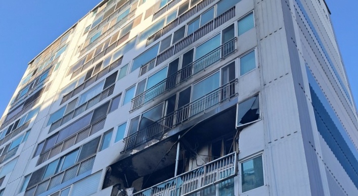 Two butane gas explosions start fires in apartments, killing one