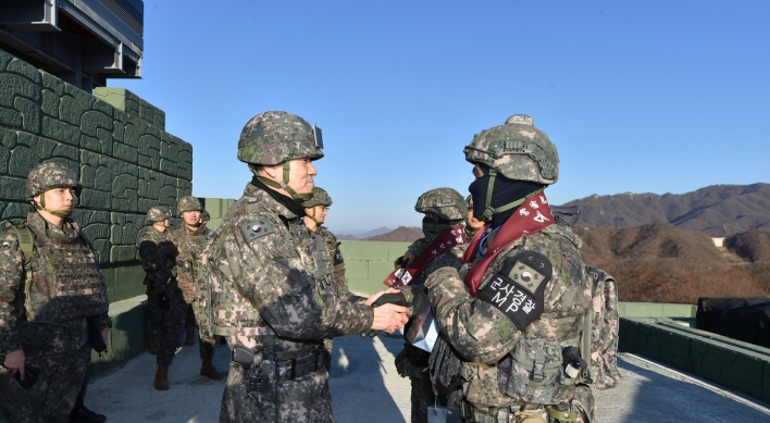 Top military officer inspects partially restored guard post inside DMZ