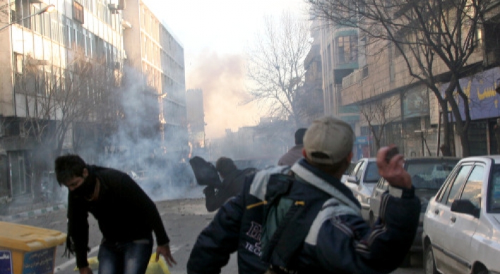Iranian protesters clash with police