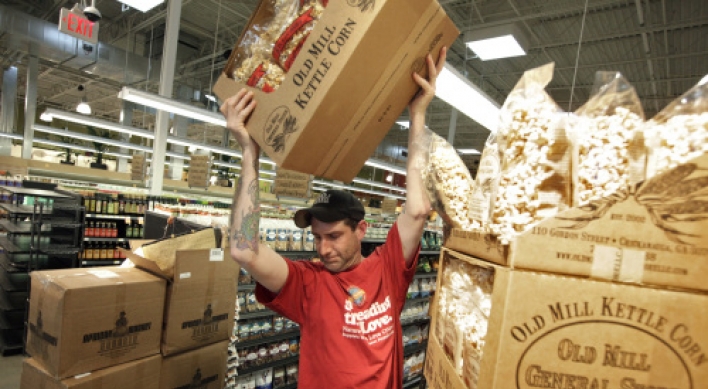 Recession-racked shoppers still splash on buying organics