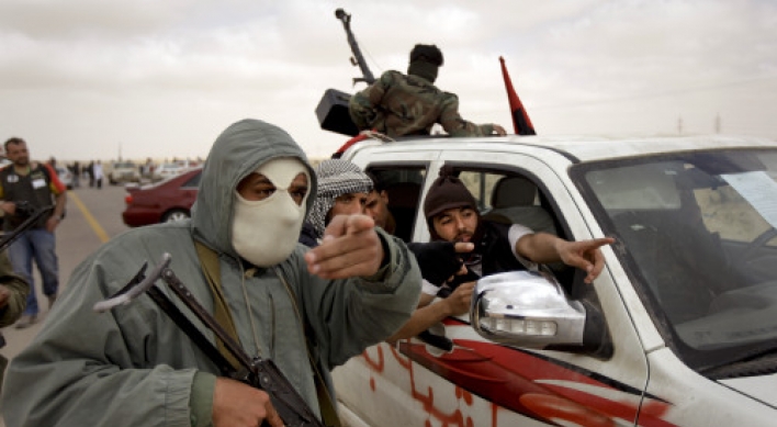 Gadhafi asks Obama to end airstrikes