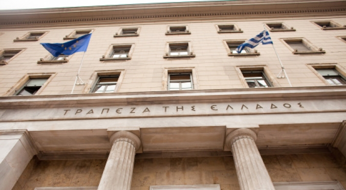 Greece hit by new downgrade on debt fears