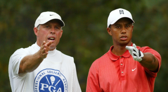 Tiger’s former caddie rips him with racial comment