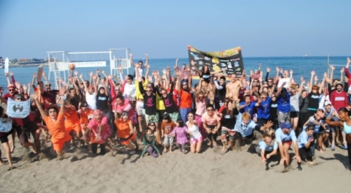 Charity volleyball tourney on Jeju beach