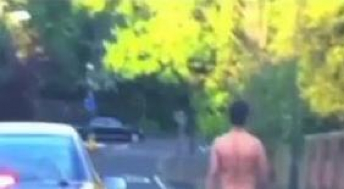 Naked man witnessed cruising down street