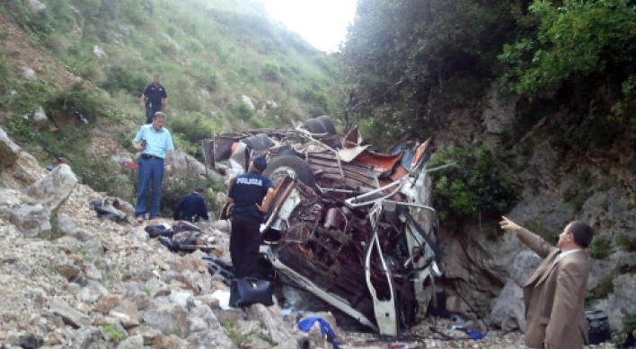 Bus with students falls off Albania cliff; 12 die