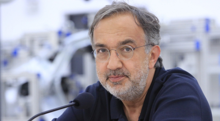 VW calls for Marchionne to quit as head of auto group