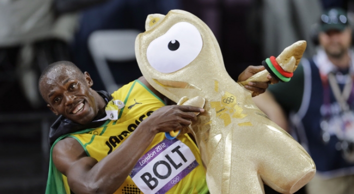 Bolt defends his Olympic 100 title in London