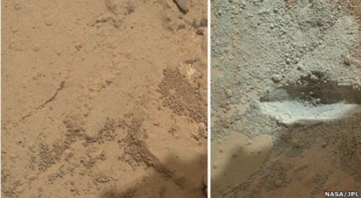 Martian rover drills first rock