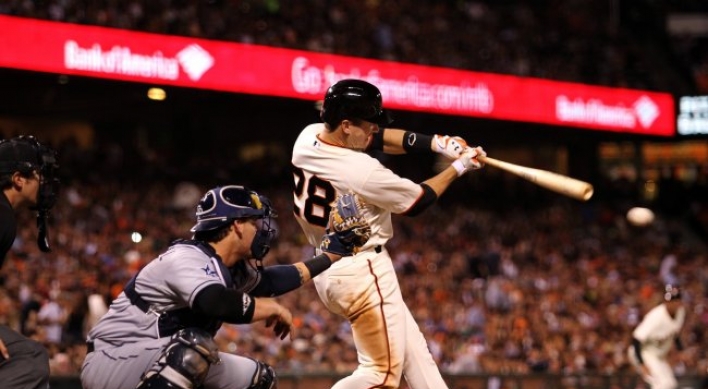 Hudson leads Giants past Padres 3-2
