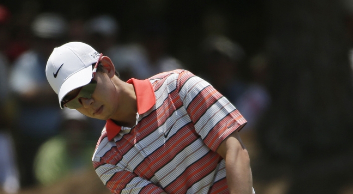 Kaymer protects lead on tough day