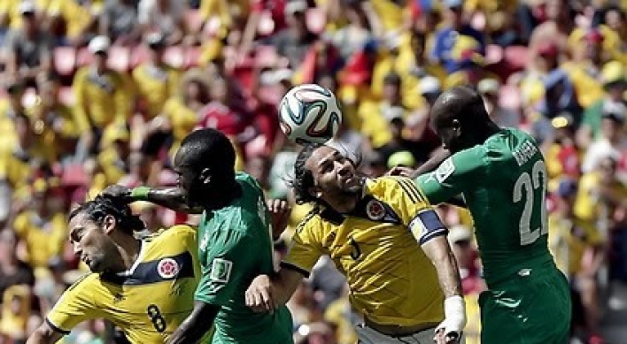 [World Cup] Colombia down Ivory Coast as Suarez returns