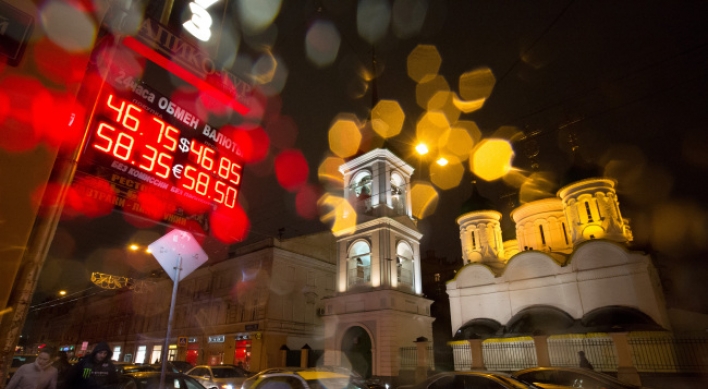 Ruble rebounds from brink but Russians wary