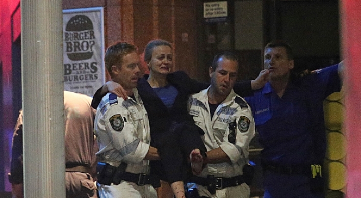 Gunman, 2 hostages killed as police storm Sydney siege cafe
