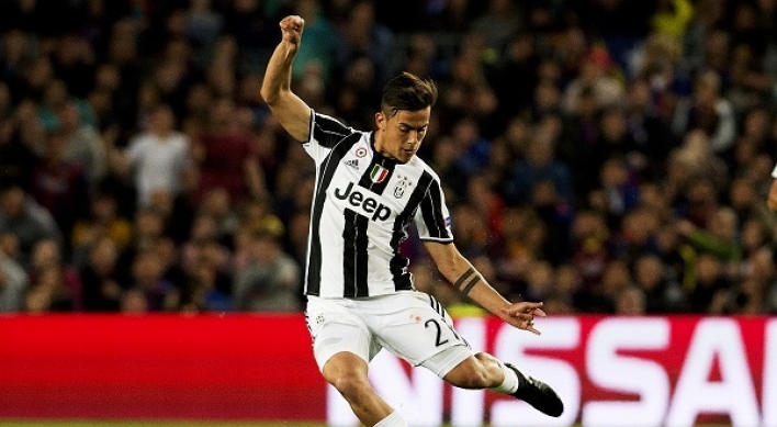 Juventus hold firm to knock out Barcelona