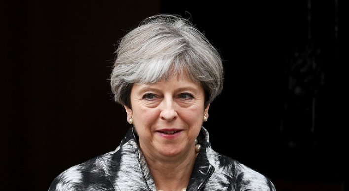 May apologizes to own MPs for election ‘mess’