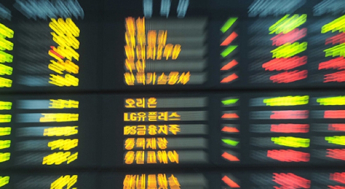 Seoul shares down in late morning on tech losses