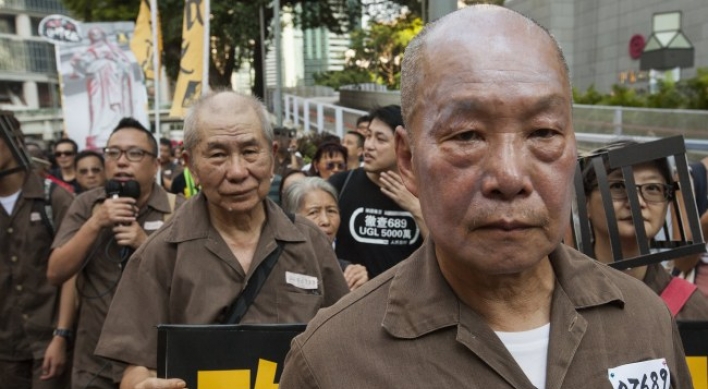 Crowds rally in Hong Kong after activists jailed