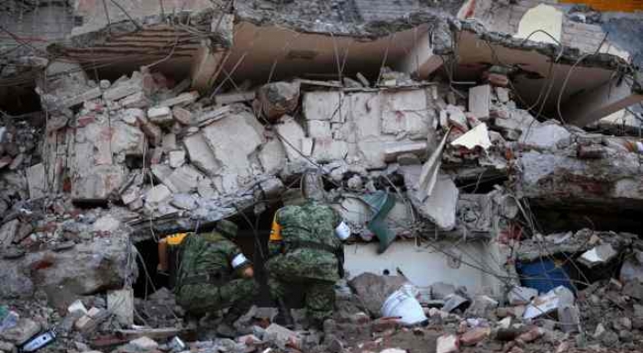 Mexico quake kills 65, deadly storm strikes