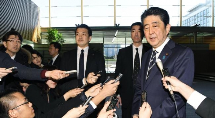 Abe to attend Olympics opening, hopes for summit with Moon