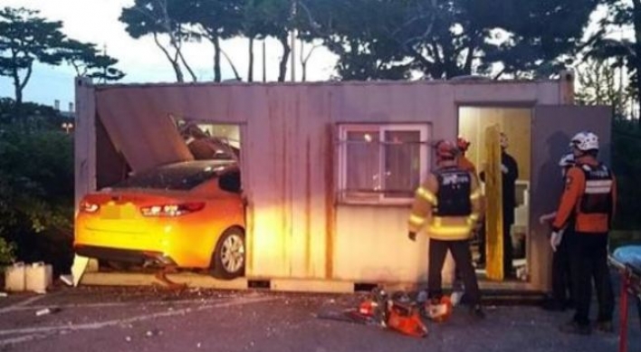 Taxi drives into Incheon Airport parking lot container