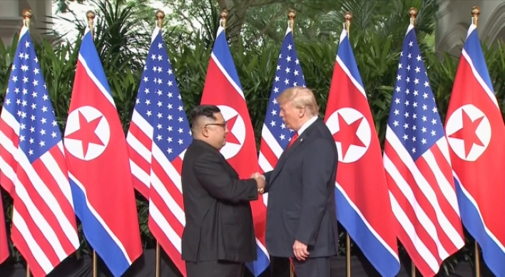 [US-NK Summit] Trump, Kim shake hands to open momentous summit