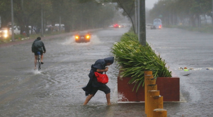 Ferocious typhoon plows through rain-soaked Philippines