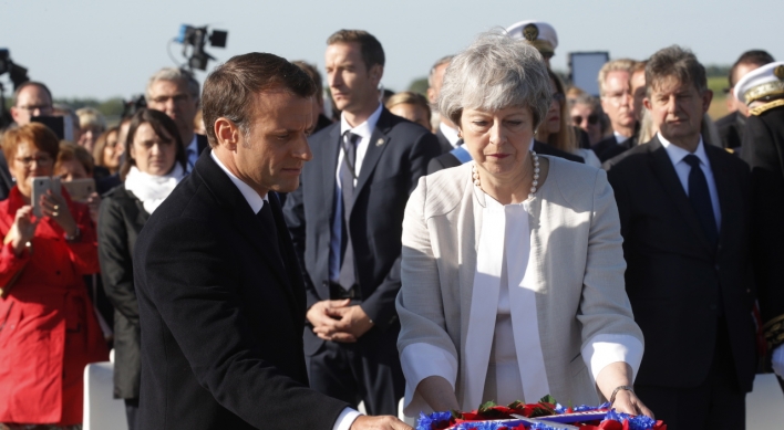 Macron praises May and looks beyond Brexit on D-Day