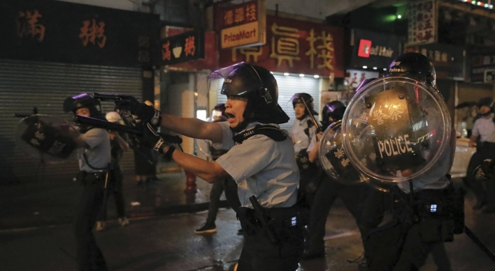 Hong Kong police fire first gunshot, water cannon in protest clashes