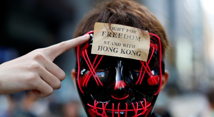 To ban or not to ban? Masked protesters in other countries