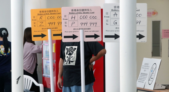 Hong Kong pro-democrats seek to hit government at district polls