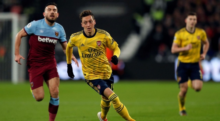 China says Arsenal's Ozil 'deceived by fake news'