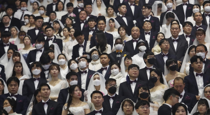 In sickness and in health: mass wedding defies virus fears