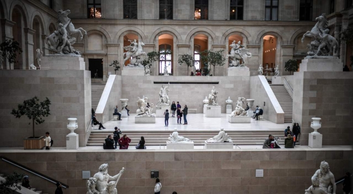 France closes Louvre as virus cases mount in Europe