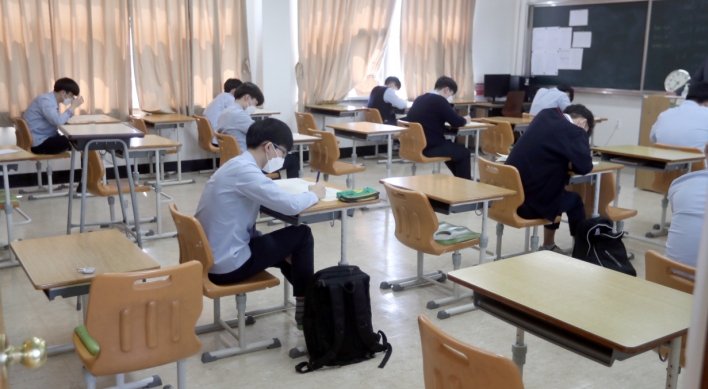 High school seniors sit exam back in classroom