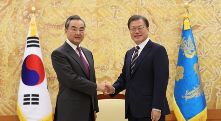 Wang Yi says Xi visit requires 'complete control' of COVID-19