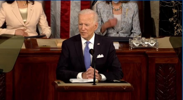 Biden pledges to work with allies to address NK threats through