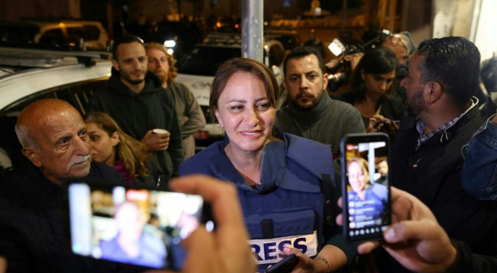 Israel arrests Jerusalem activist as reporter recovers